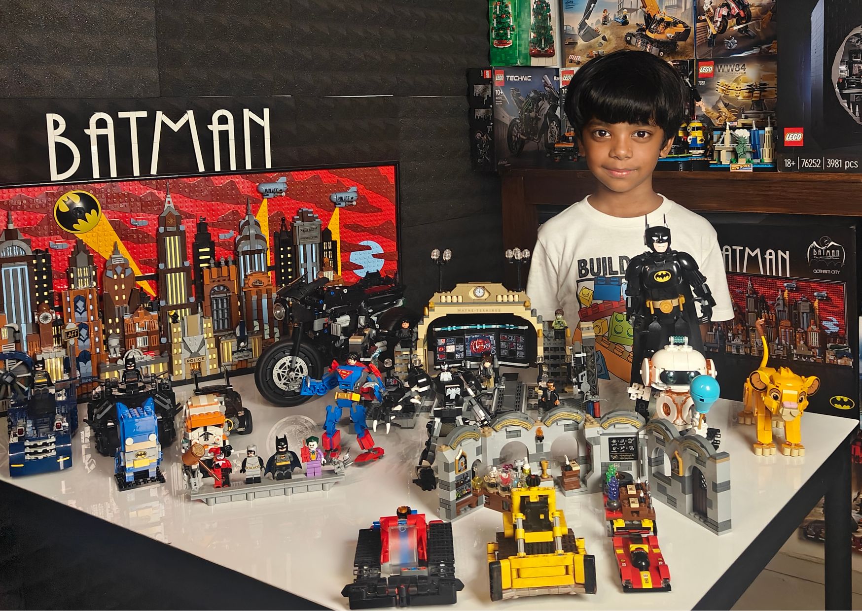 Mithran, Junior Master Builder, surrounded by his LEGO Batman collection